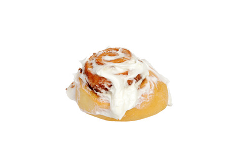 isolated cinnamon bun with icingの写真素材