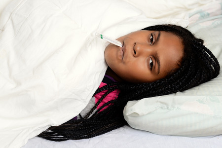 sick child in bedの写真素材