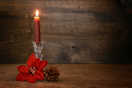 candle with poinsettia flowerの写真素材