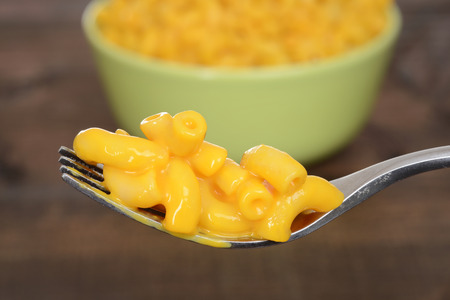 macro macaroni and cheese on a forkの写真素材