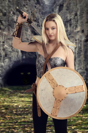 female warrior getting ready to fight a dragonの写真素材