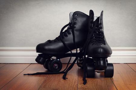 men's roller skates on hardwood floorの写真素材