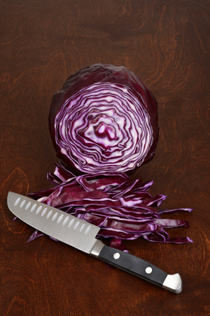 closeup sliced red cabbage with knifeの写真素材