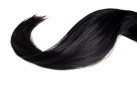 piece of black hair in a wave isolatedの写真素材