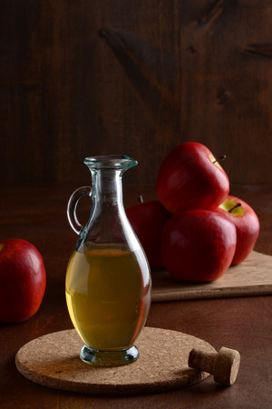 closeup apple cider vinegar on cork matの写真素材