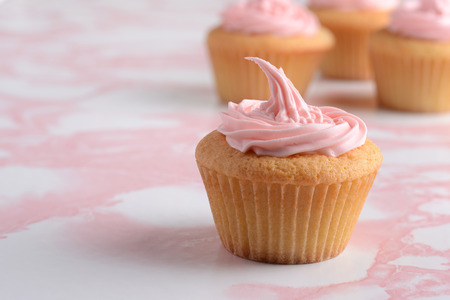 closeup cupcake with pink icingの写真素材