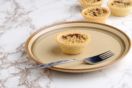 fruit crumble tart with a forkの写真素材