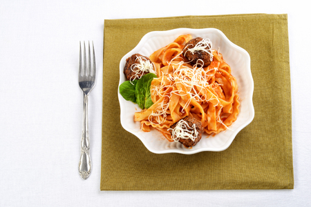high angle spaghetti and meatballs in white bowlの写真素材