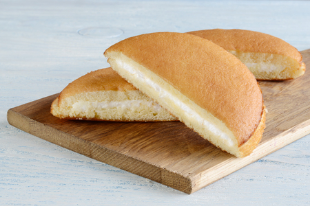 closeup three slices sponge cake with vanilla cream fillingの写真素材
