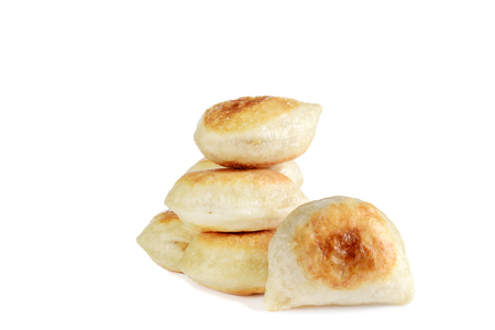 closeup pile of pierogies on whiteの写真素材