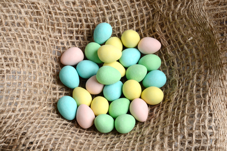 closeup top view easter candy eggs in a nestの写真素材