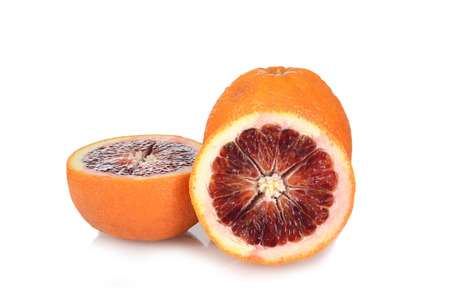 sliced blood oranges on whiteの写真素材