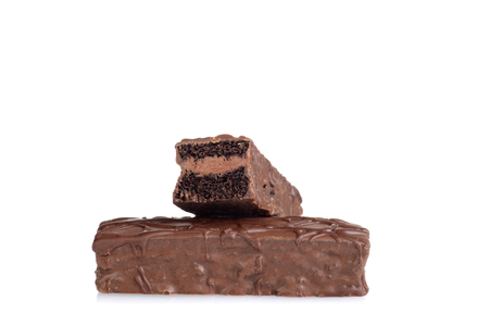 sliced chocolate bar cake on whiteの写真素材