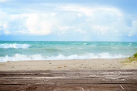 wood table with tropical summer ocean seascape backgroundの写真素材