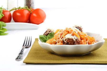 closeup of spaghetti and meatballs in a bowlの写真素材