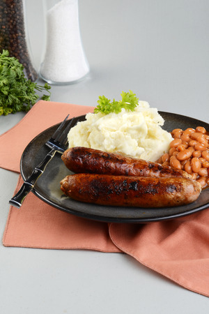 chorizo sausages with mashed potato and forkの写真素材