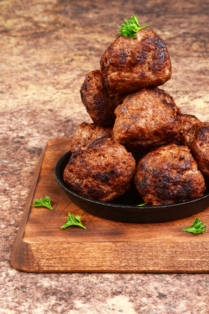 closeup meatballs in cast iron skilletの写真素材