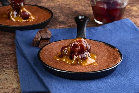 dessert pan with brownie bing cherries and caramel sauceの写真素材