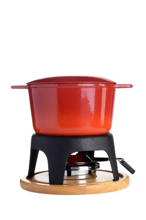 isolated red cast iron fondue potの写真素材