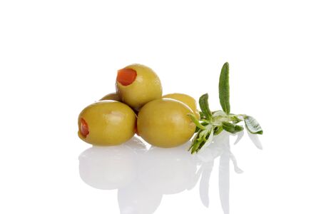pile of pimento green olives with fresh rosemary herbの写真素材