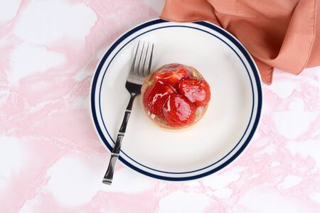 top view strawberry glazed tart with a napkinの写真素材