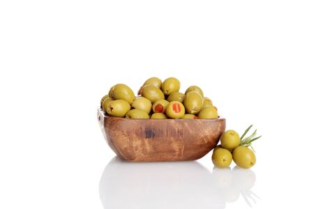 wood bowl of pimento green olivesの写真素材