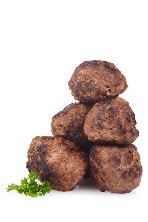 stack of homemade cooked meatballs on whiteの写真素材