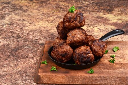 stack of meatballs in cast iron skilletの写真素材