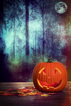 halloween pumpkin in spooky forest sceneの写真素材