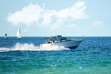 modern powerboat speeding on lakeの写真素材