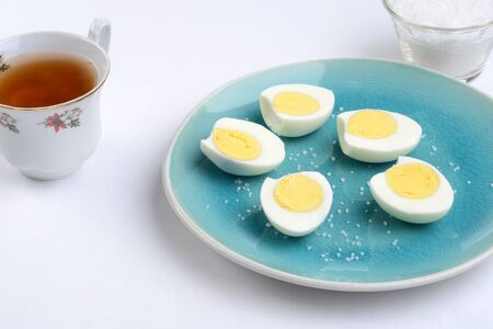 sliced boiled eggs with cup of tea