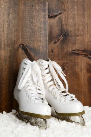 women ice skates with wood wallの写真素材
