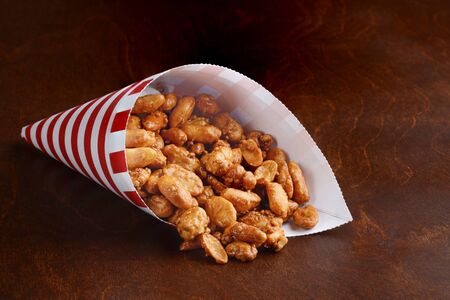 red and white cone with honey covered peanutsの写真素材