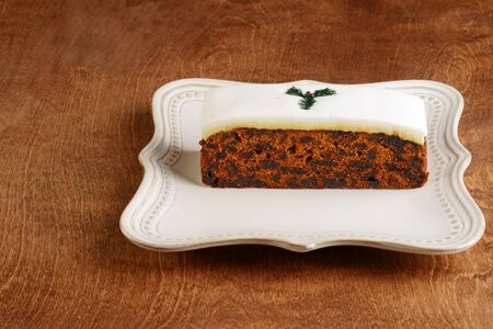 christmas fruitcake with fondant on a platterの写真素材