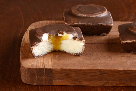 closeup chocolate cake filled with vanilla cream and caramelの写真素材