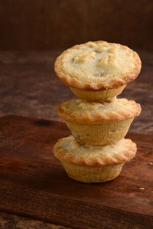 closeup stack of christmas mincemeat piesの写真素材