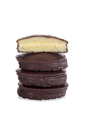 stack of chocolate custard cream filled sponge cakesの写真素材