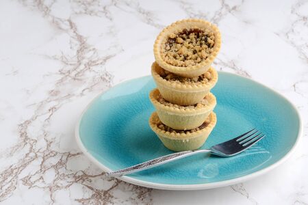 stack of fruit tarts with crumble toppingの写真素材