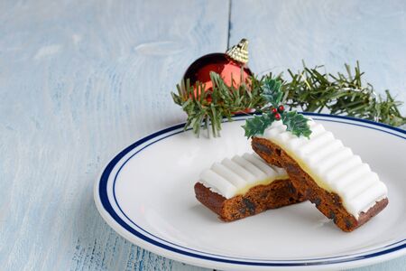 fruit cake slices with christmas decorationsの写真素材