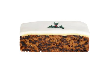 isolated christmas cake with holly decorationの写真素材
