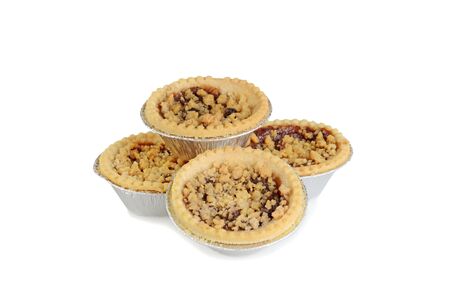 pile of fruit tarts with crumble toppingの写真素材