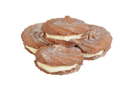 isolated pile of gingerbread swirl cookies with cream fillingの写真素材