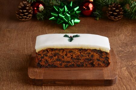 fruitcake on a wood cutting boardの写真素材