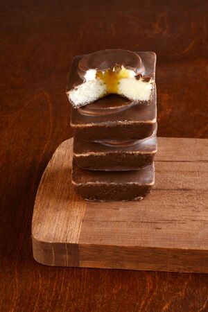 stack of caramel chocolate vanilla cakesの写真素材