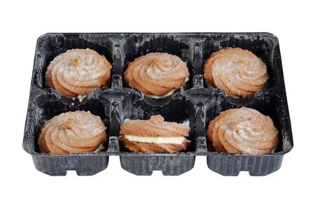 isolated tray of gingerbread swirl cookies with cream fillingの写真素材