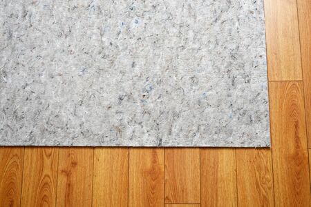 area rug felt under pad on hardwood floorの写真素材