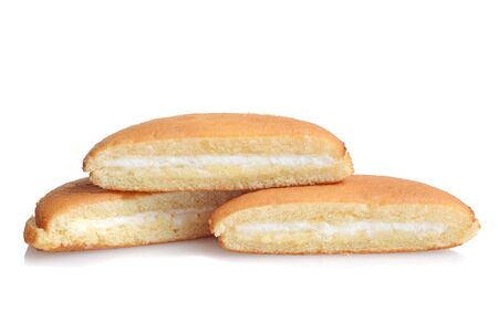 three slices of vanilla sponge cake with cream fillingの写真素材
