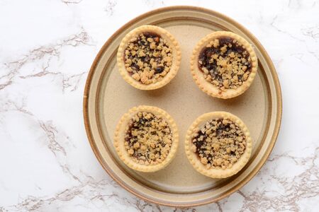 top view four fruit crumble tartsの写真素材