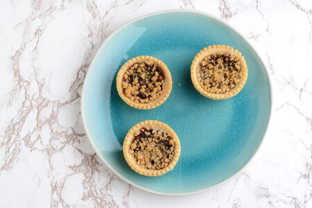 top view fruit tarts with crumble toppingの写真素材
