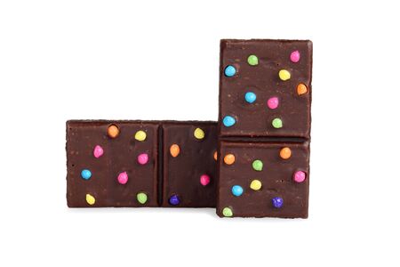 two brownies with colorful candy pieces on whiteの写真素材